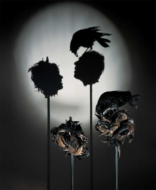 Illustration for article titled Gruesome shadow art transforms garbage and mummified rats into severed heads